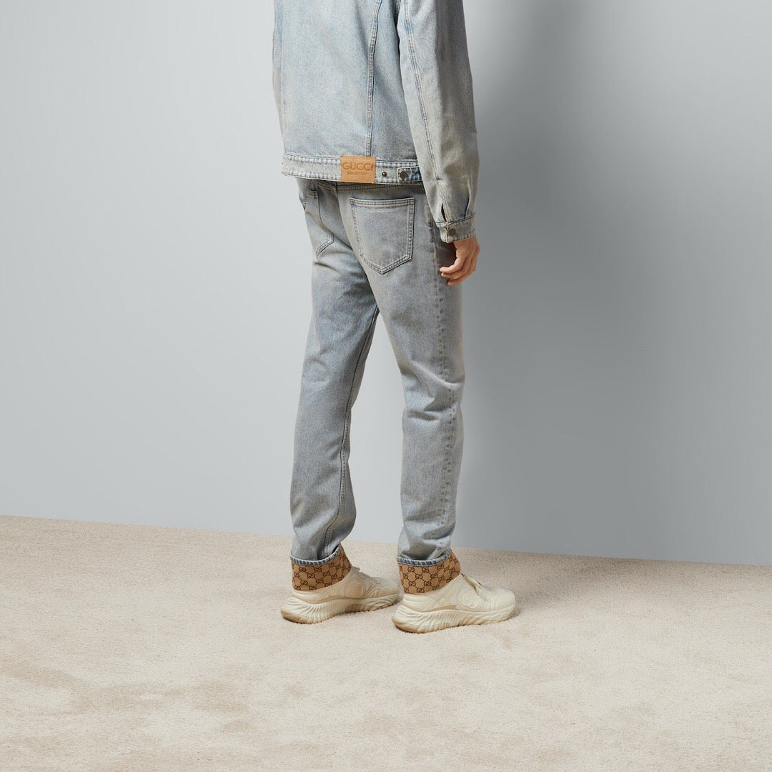 Jeans with floral pattern on hem blue<span class="brand-imgs GUCCI"></span>