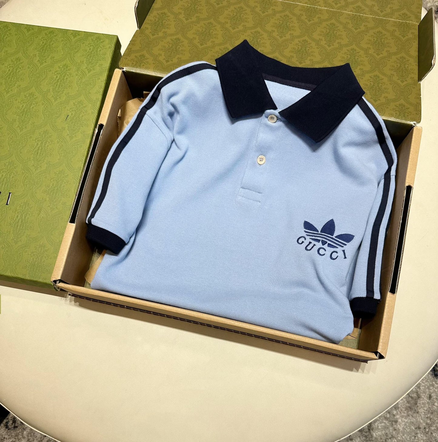 Co branded polo light blue<span class="brand-imgs GUCCI"></span>